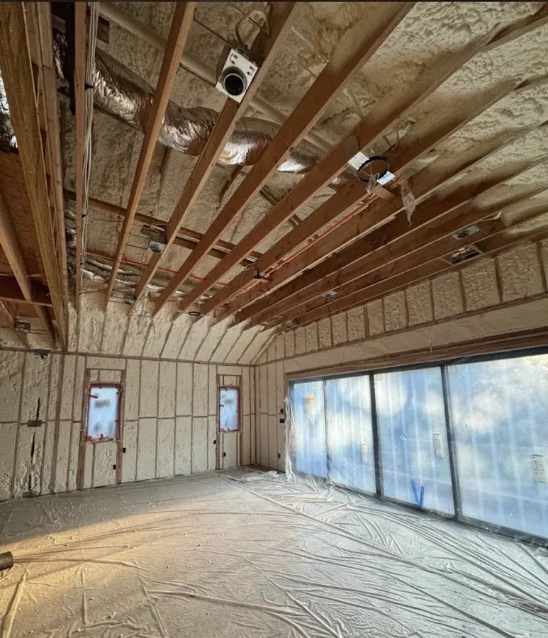 Interior walls and ceiling insulated with spray foam during new construction in Maquoketa